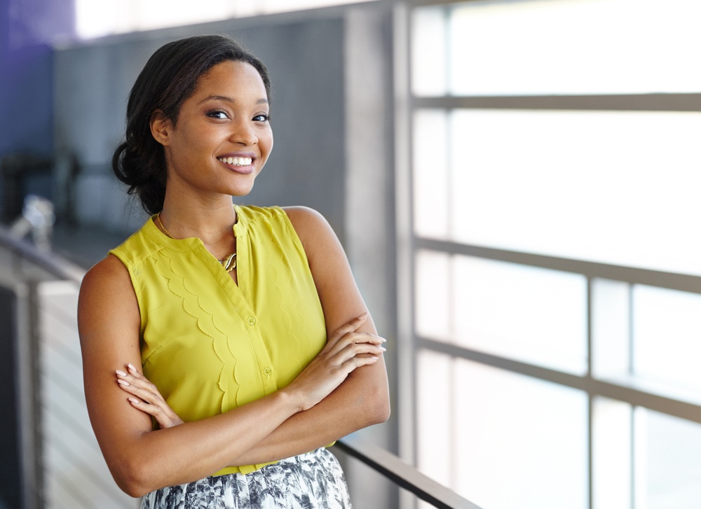 Portrait of a confident black businesswoman at work in her glass office.jpeg